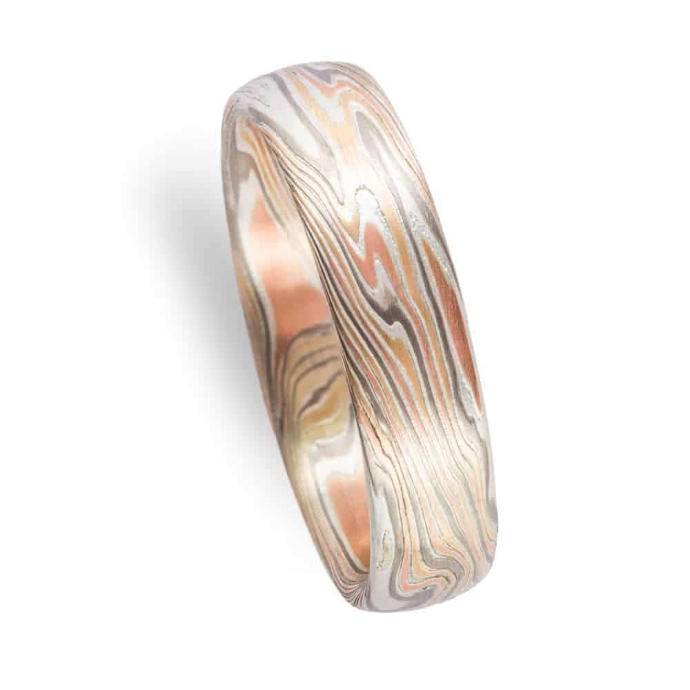 mokume gane twist pattern band with etched finish, red gold yellow gold palladium and silver