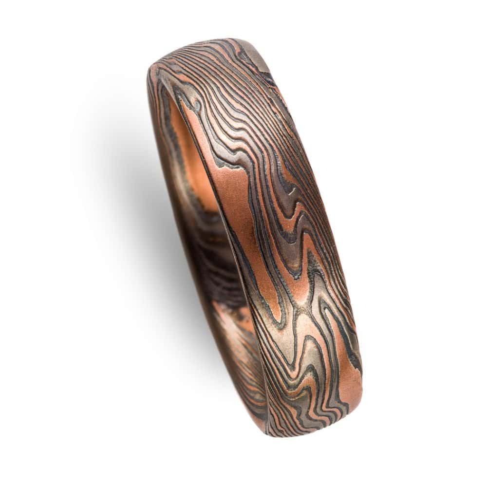 mokume twist patterned ring with dark look, made with red gold, palladium and oxidized silver