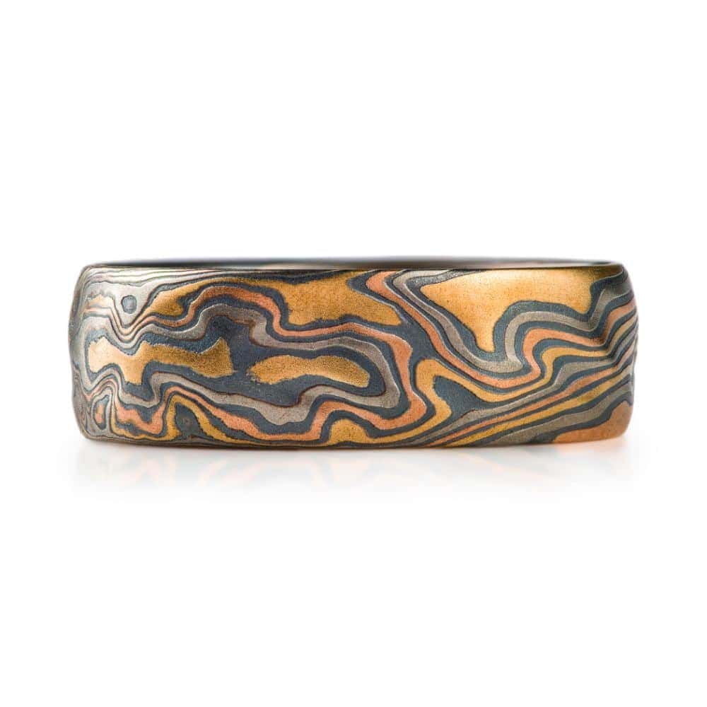 wide mokume gane patterned band, made with multiple different metals in a twist pattern