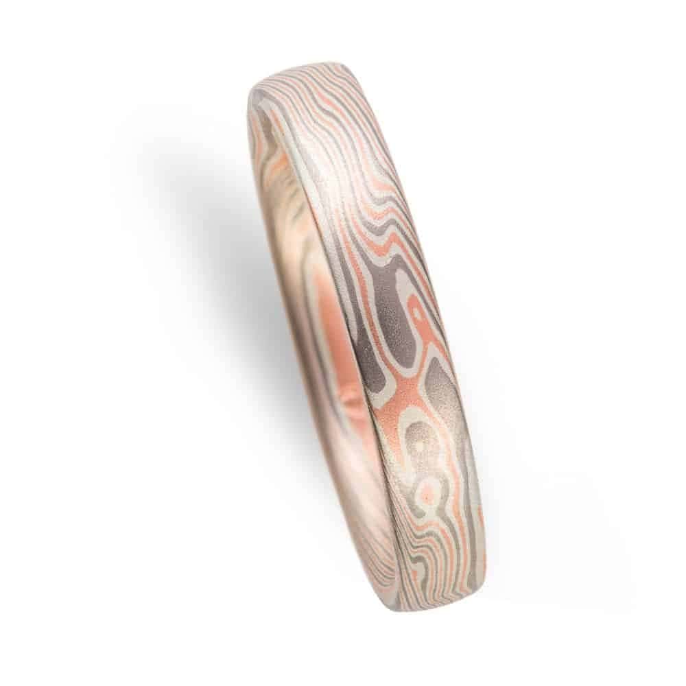 light colored narrow band patterned in twist mokume pattern