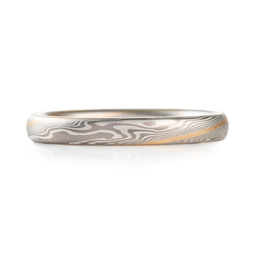 narrow and small, delicate feeling mokume twisted pattern band, made in silvery metals