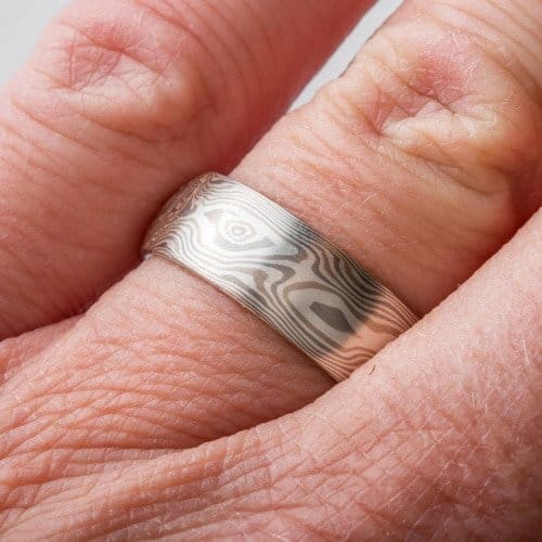 wide mokume gane wedding band in light palette and woodgrain pattern