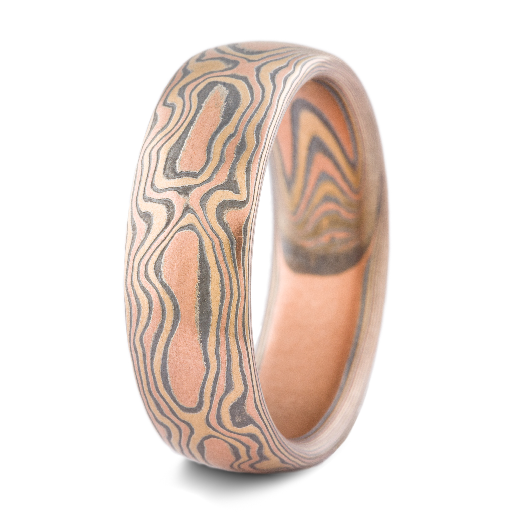 warm toned mokume gane band patterned to look like woodgrain