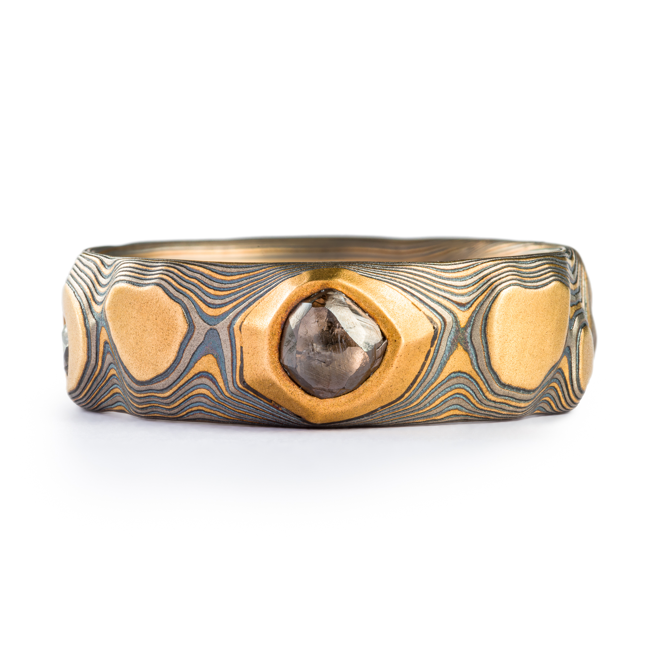 yellow gold, silver and palladium metal with striped Guri Bori, mokume gang with a raw diamond inset in the yellow gold