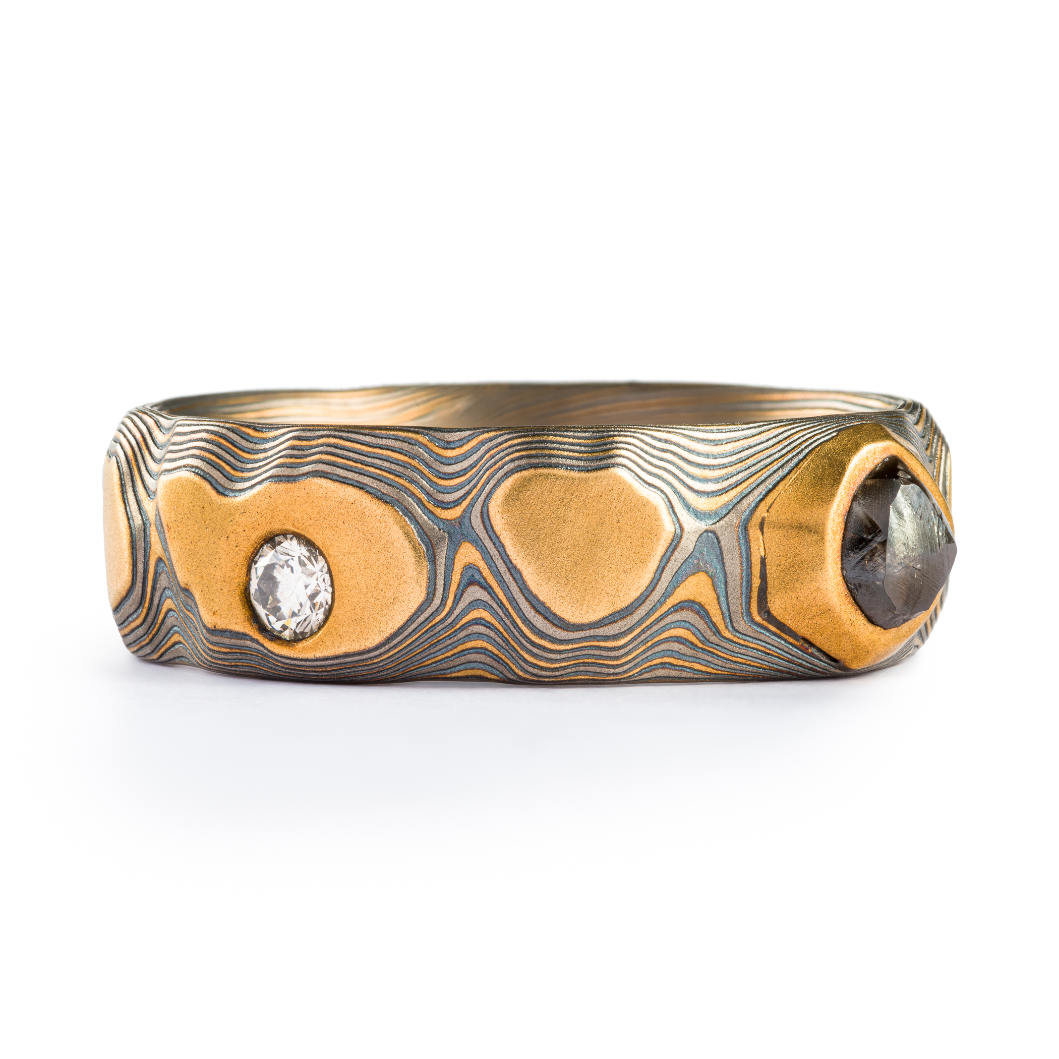 yellow gold, silver and palladium metal with striped Guri Bori, mokume gang with a raw diamond inset in the yellow gold
