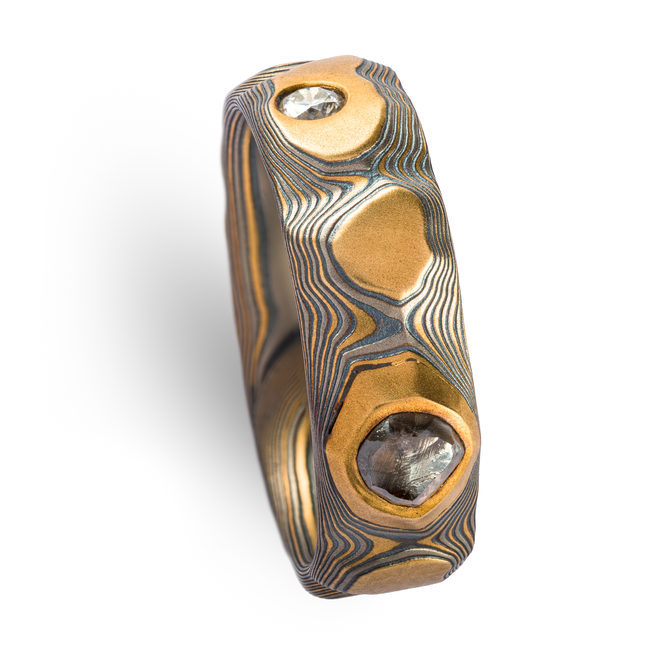 yellow gold, silver and palladium metal with striped Guri Bori, mokume gang with a raw diamond inset in the yellow gold