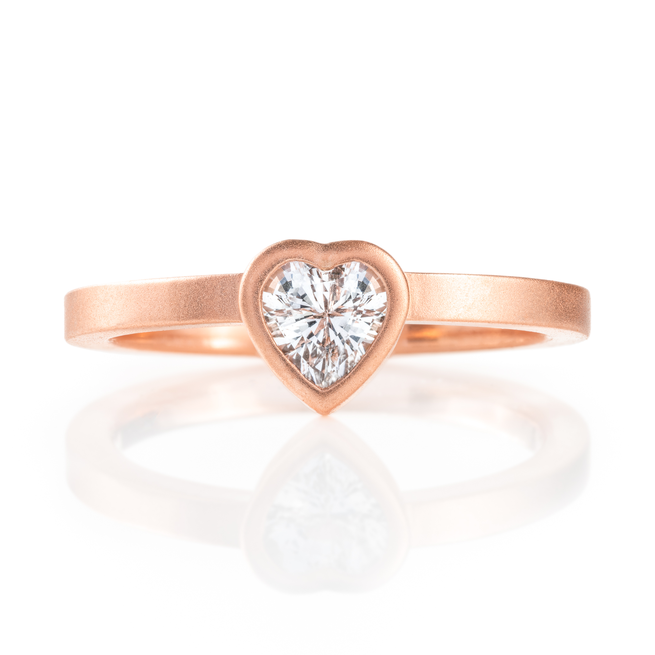 custom made three part claddagh ring, with mokume hands holding a white sapphire heart shaped stone, with a mokume crown on top of the stone