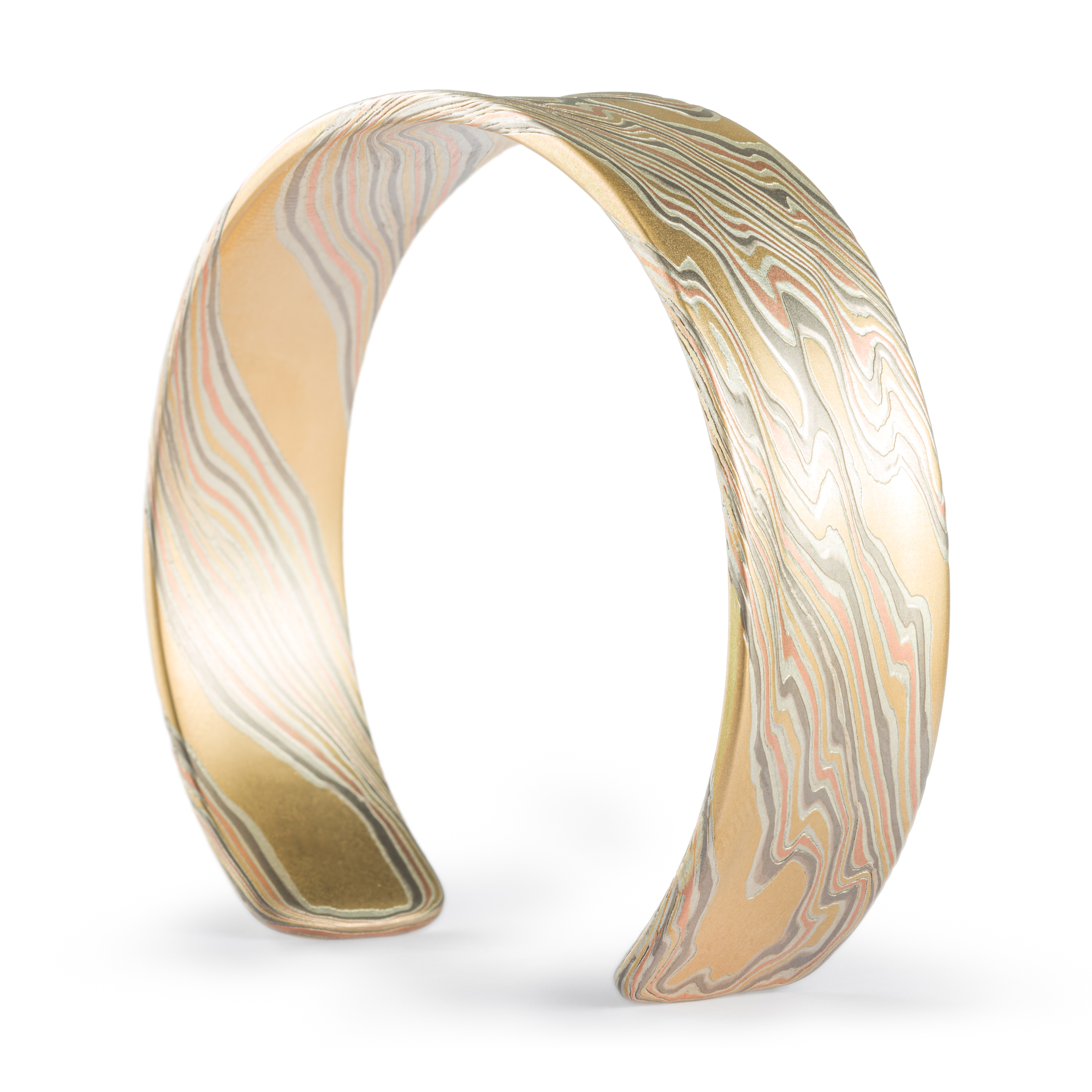 Mokume gane patterned mens bangle, wide, slightly textured, made with yellow gold, red gold, palladium and silver.