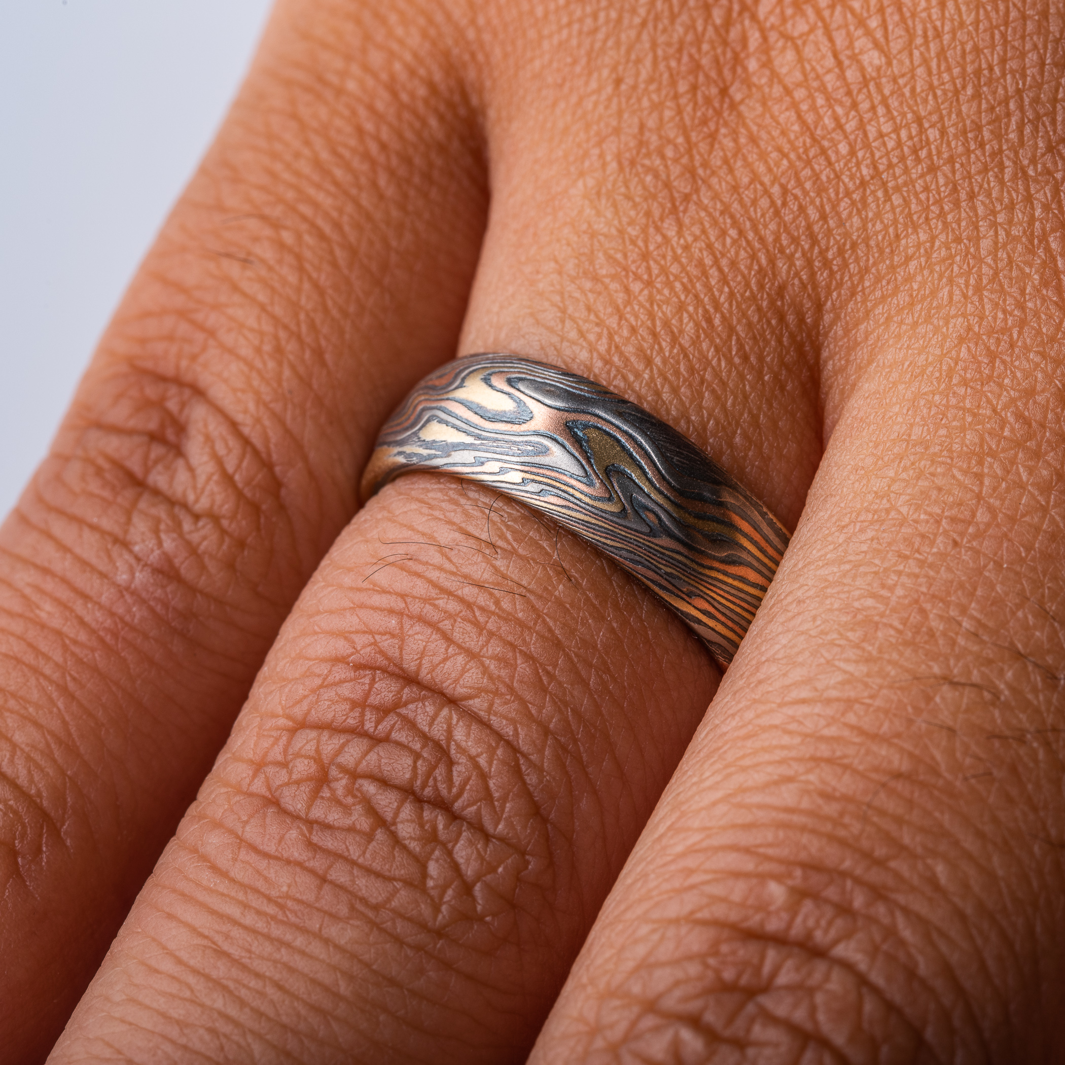 mokume gane wedding band with red gold yellow gold palladium and oxidized silvermokume gane wedding band with red gold yellow gold palladium and oxidized silver