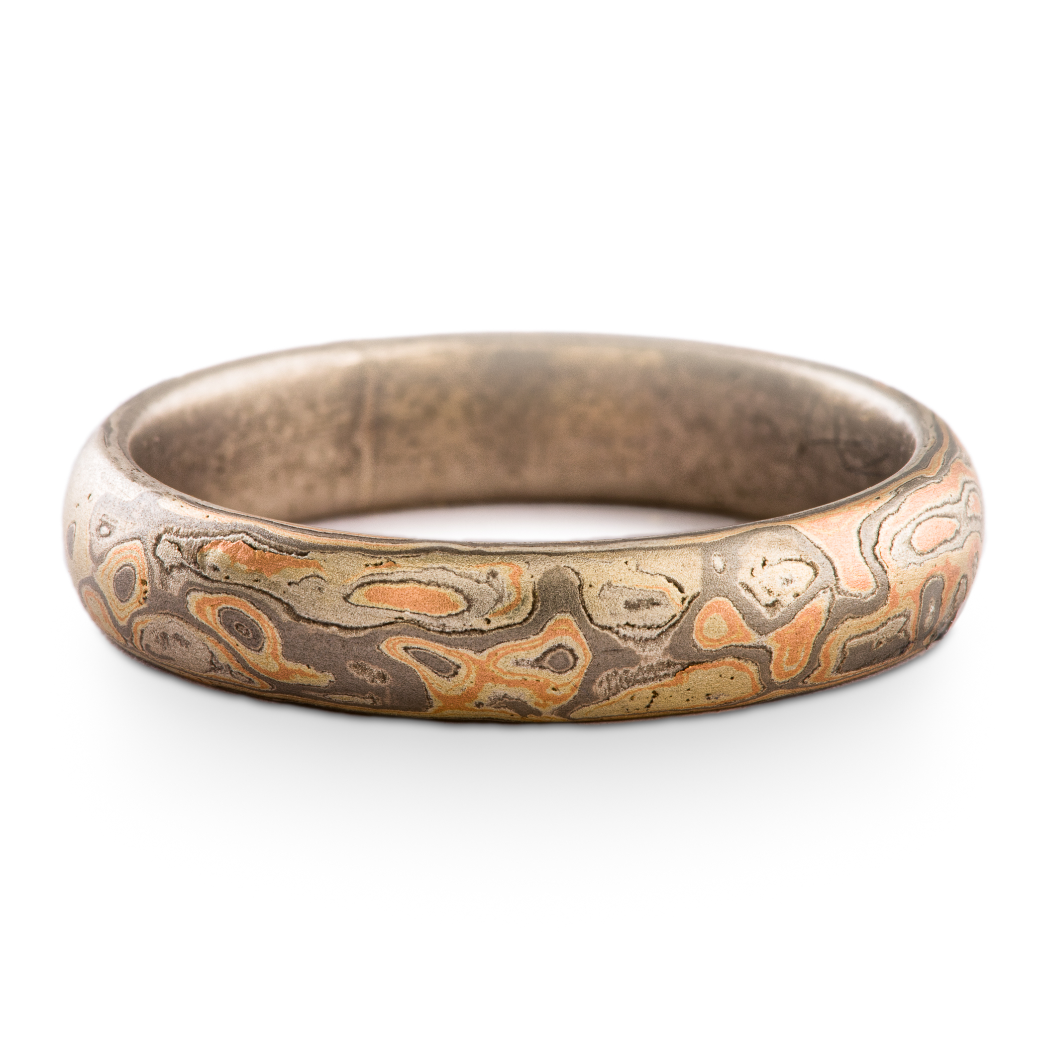 Small mokume gane ring patterned in an organic style with red gold, palladium and silver.