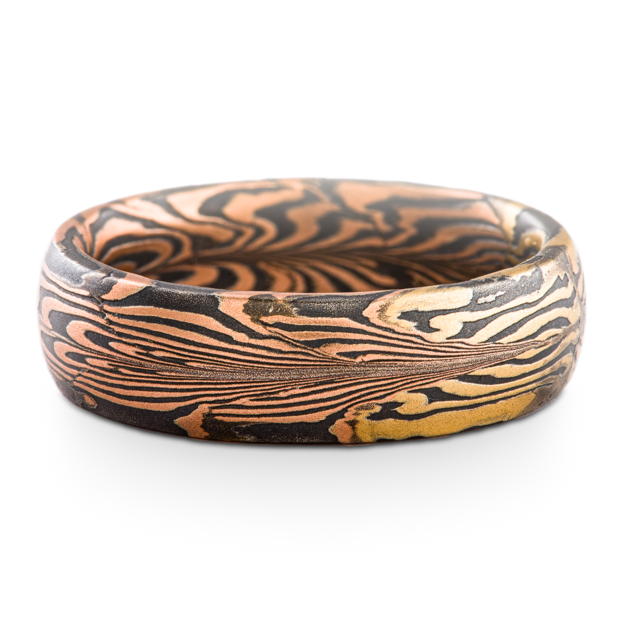 Uniquely patterned mokume gane ring in half red gold, half yellow gold, with oxidized silver.