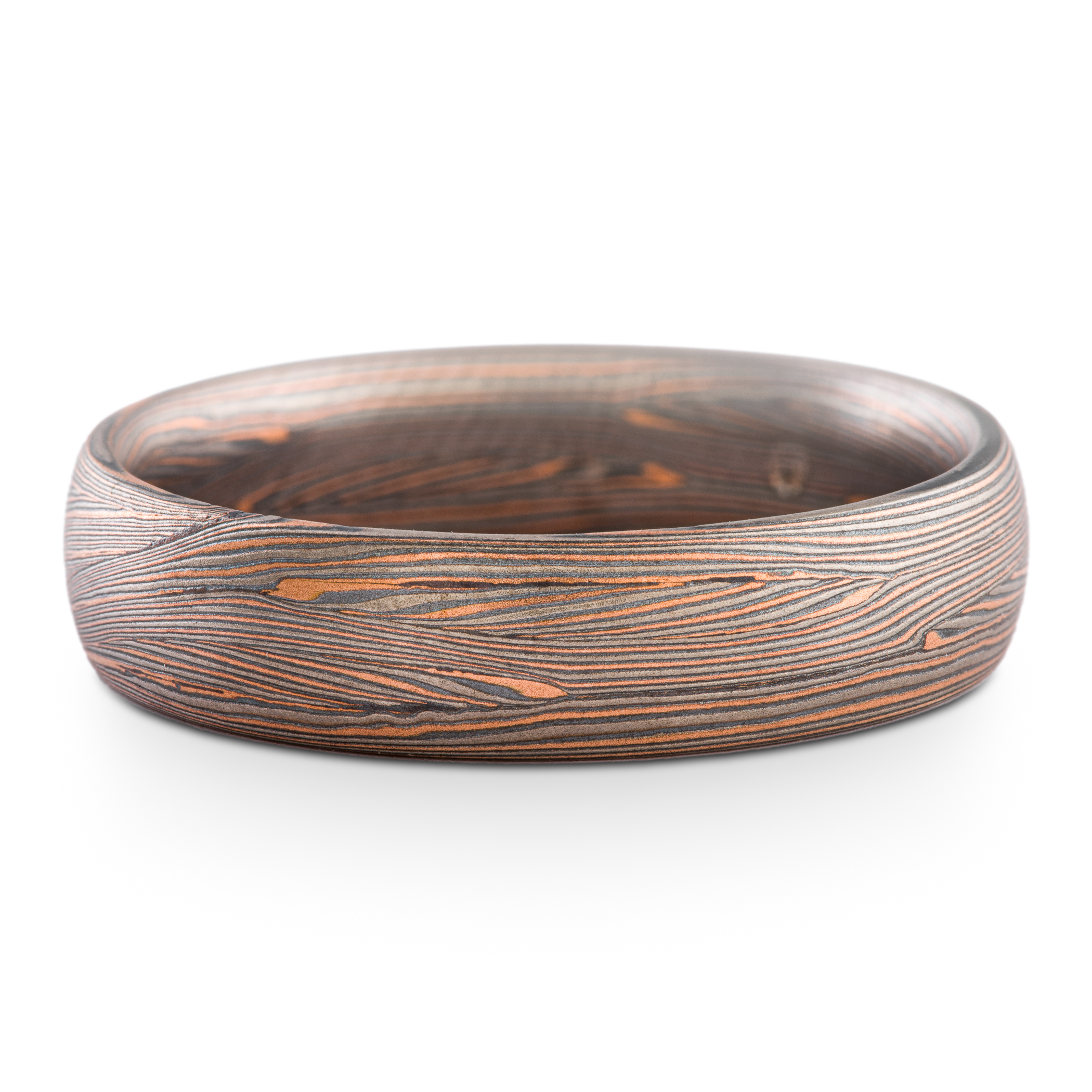 Mokume gane ring made in Arn Krebs Flow pattern made in a linear style with flowing fine lines. Made with red gold, palladium and oxidized silver.