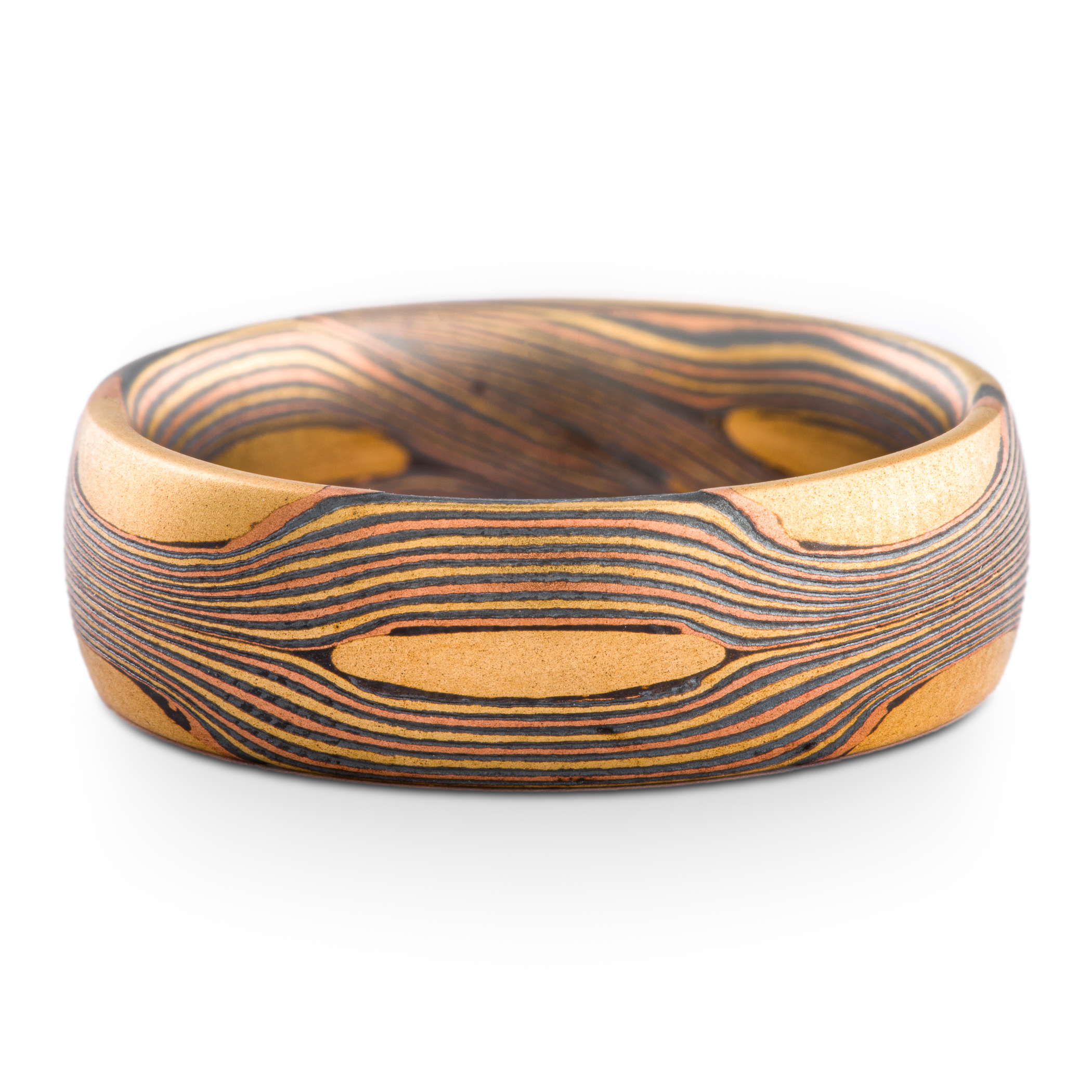 Arn Krebs Mokume Gane patterned ring, made with thin flowing lines of gold with yellow gold patches interspersed.