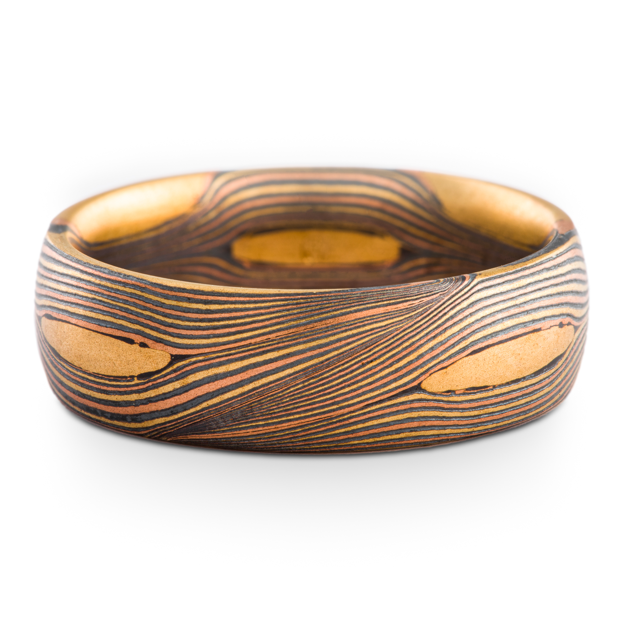Arn Krebs Mokume Gane patterned ring, made with thin flowing lines of gold with yellow gold patches interspersed.