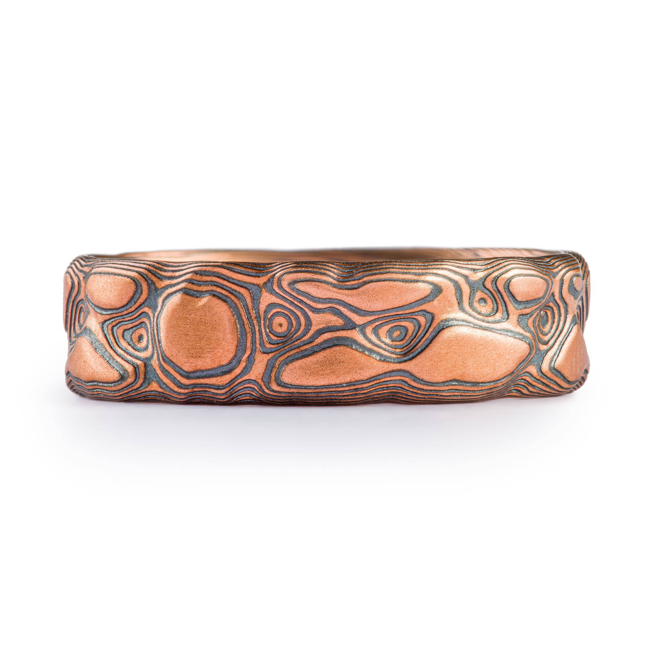 Red gold and oxidized silver textured band made to look like rock.