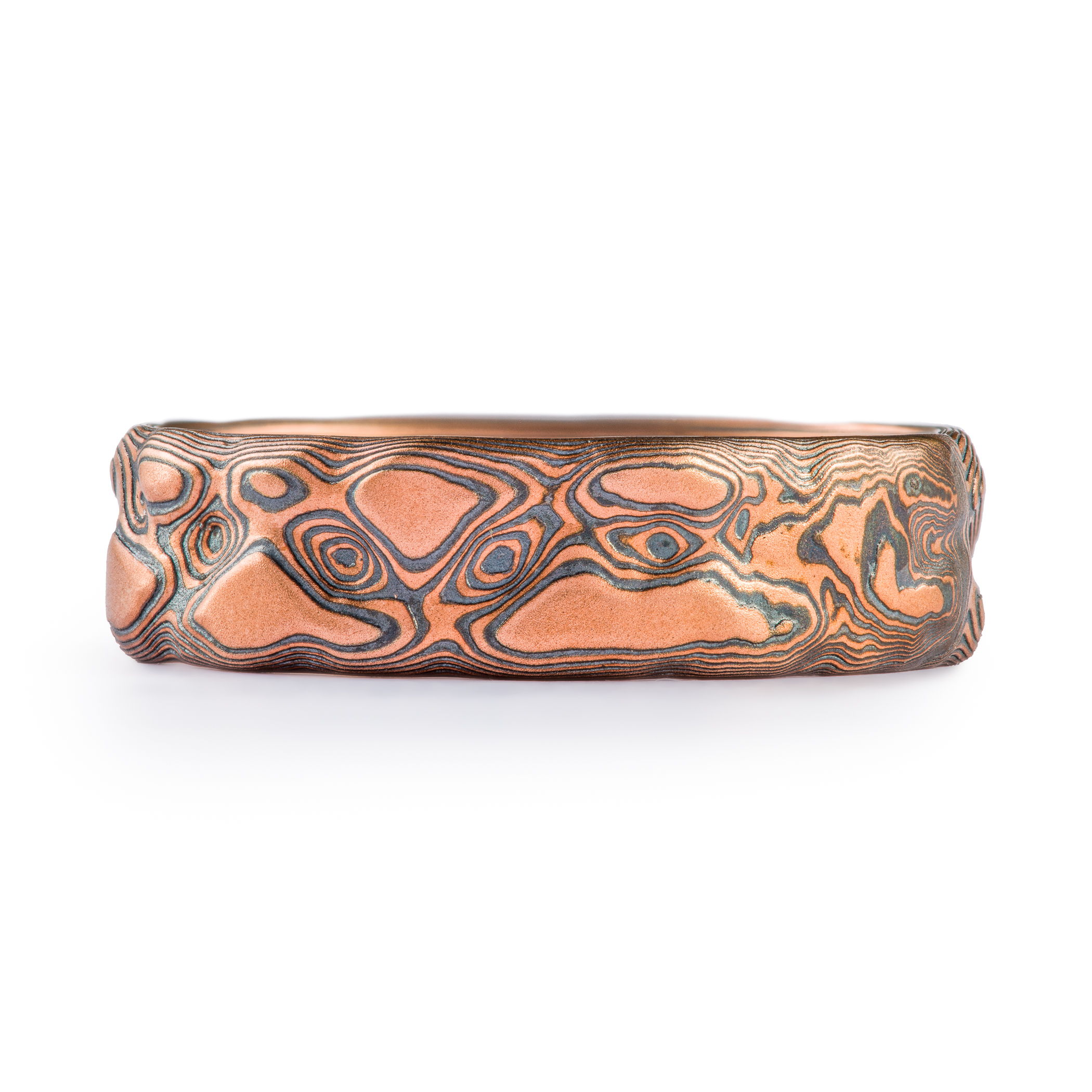 Red gold and oxidized silver textured band made to look like rock.