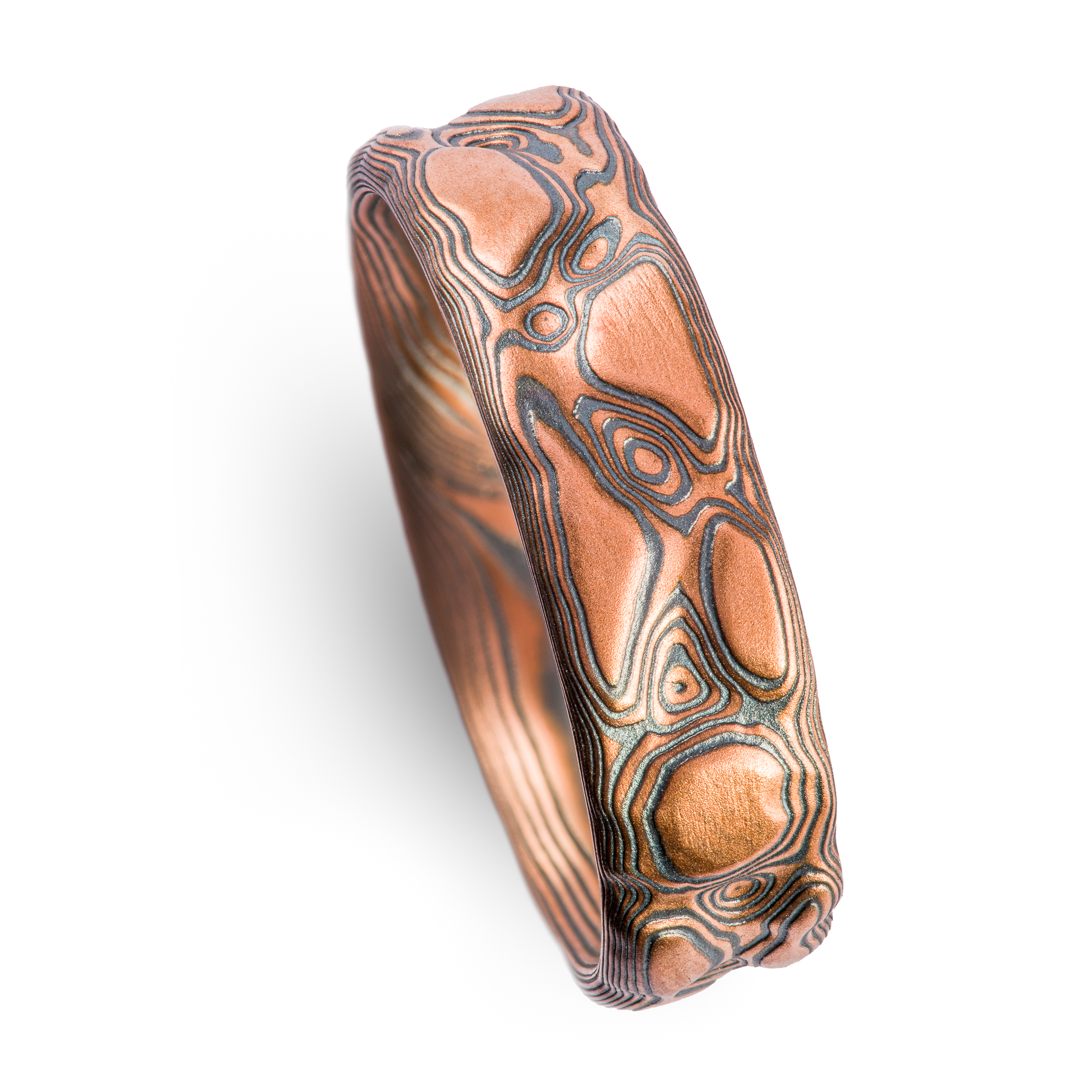 Red gold and oxidized silver textured band made to look like rock.