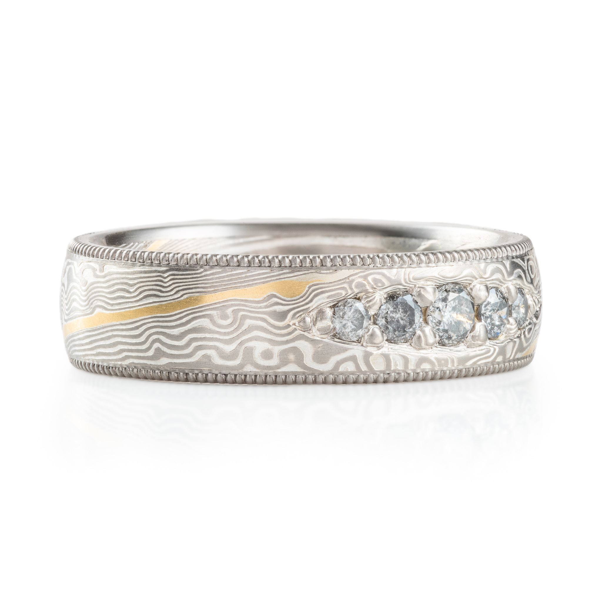 elegant wedding style band with bead set salt and pepper diamonds and milgrain rails on top and bottom edges and an added yellow gold stratum