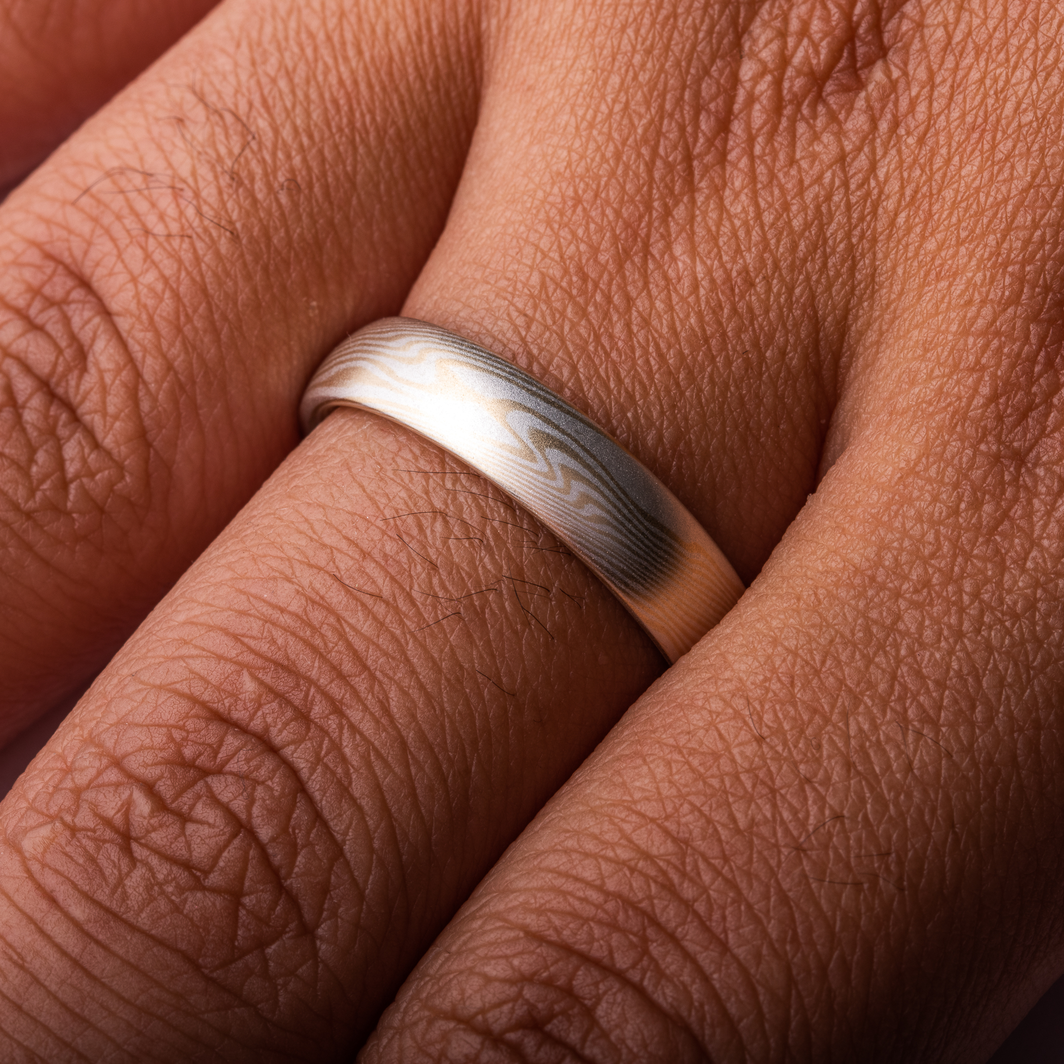 very subtle feeling yellow gold and silver mokume gane ring, soft and delicate feeling wedding band