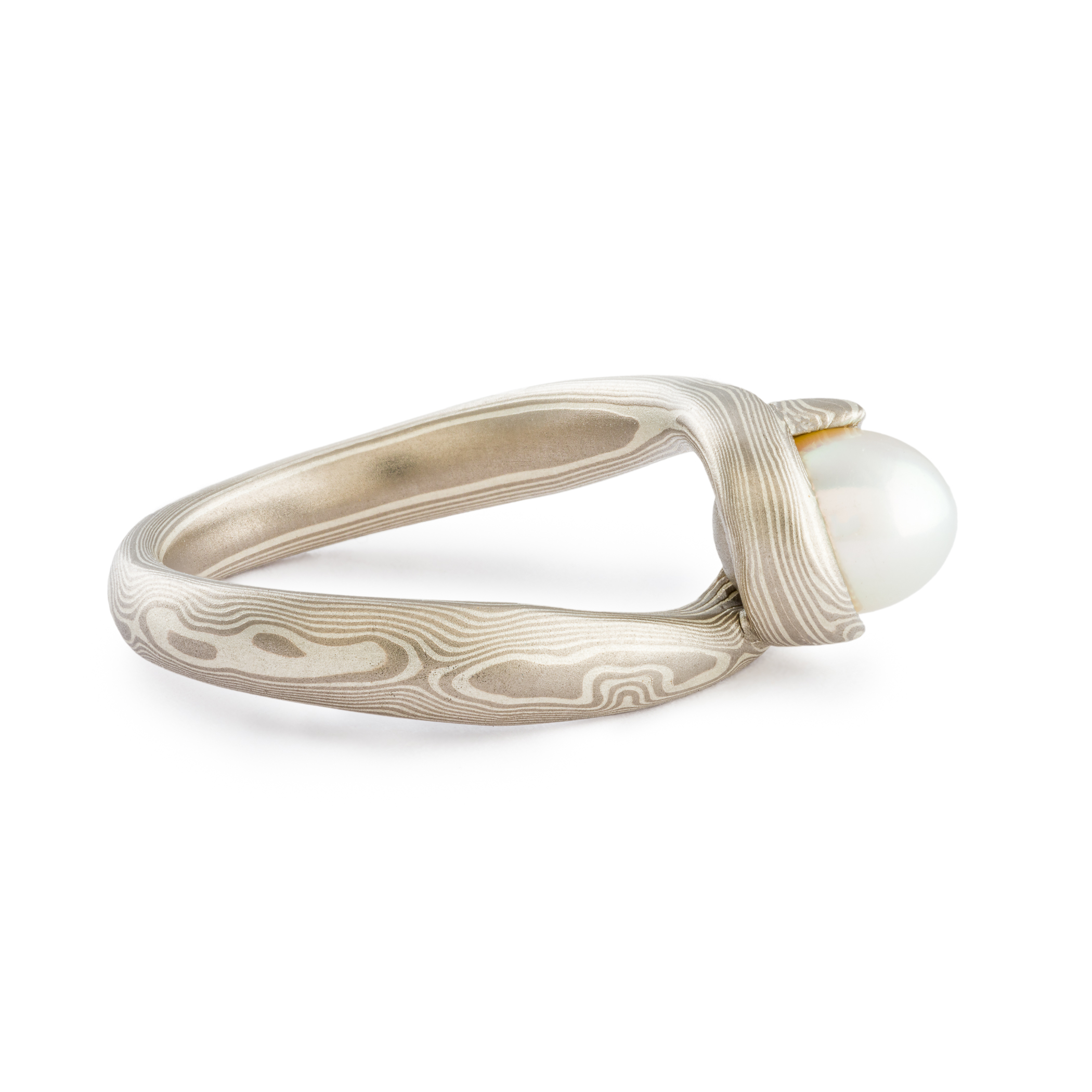 Mokume Gane ring wedding ring or engagement ring bypass style setting by arn krebs, woodgrain pattern and ash palette, white pearl, low dome, sterling silver and palladium