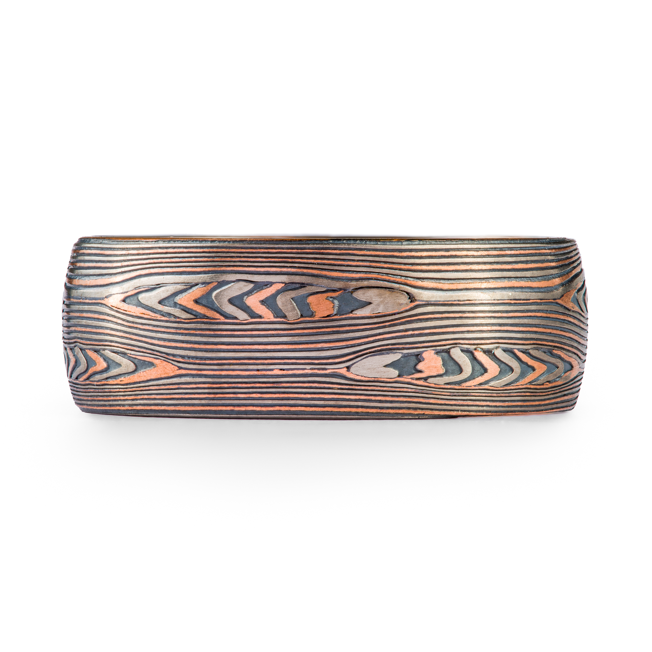 mokume gane patterned ring, layers of red gold palladium and oxidized silver. The pattern resembles flowing water and rippling pools.