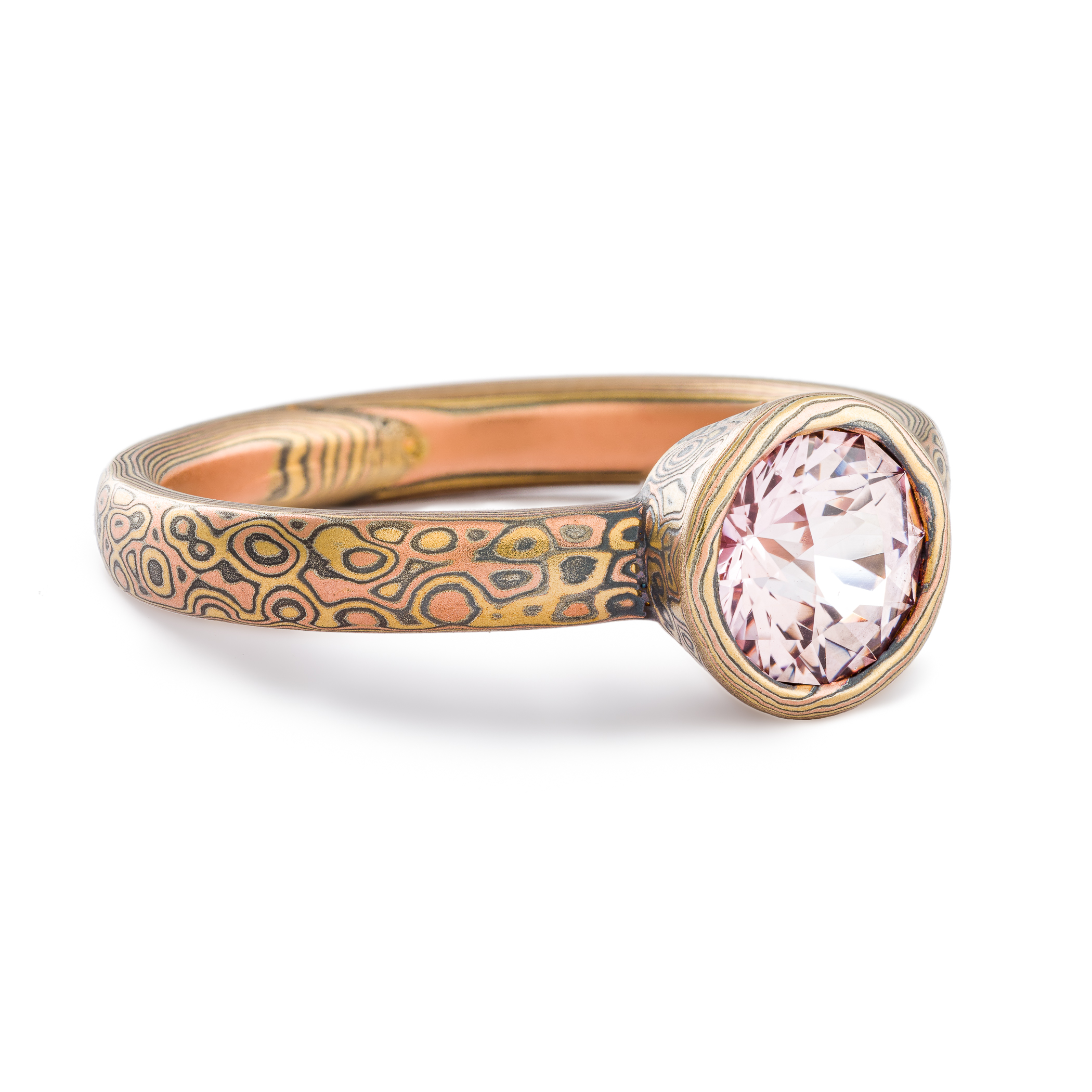 Mokume Gane ring or engagement ring arn krebs, pink sapphire in a mokume bezel, droplet pattern and fire palette, yellow gold red gold and silver