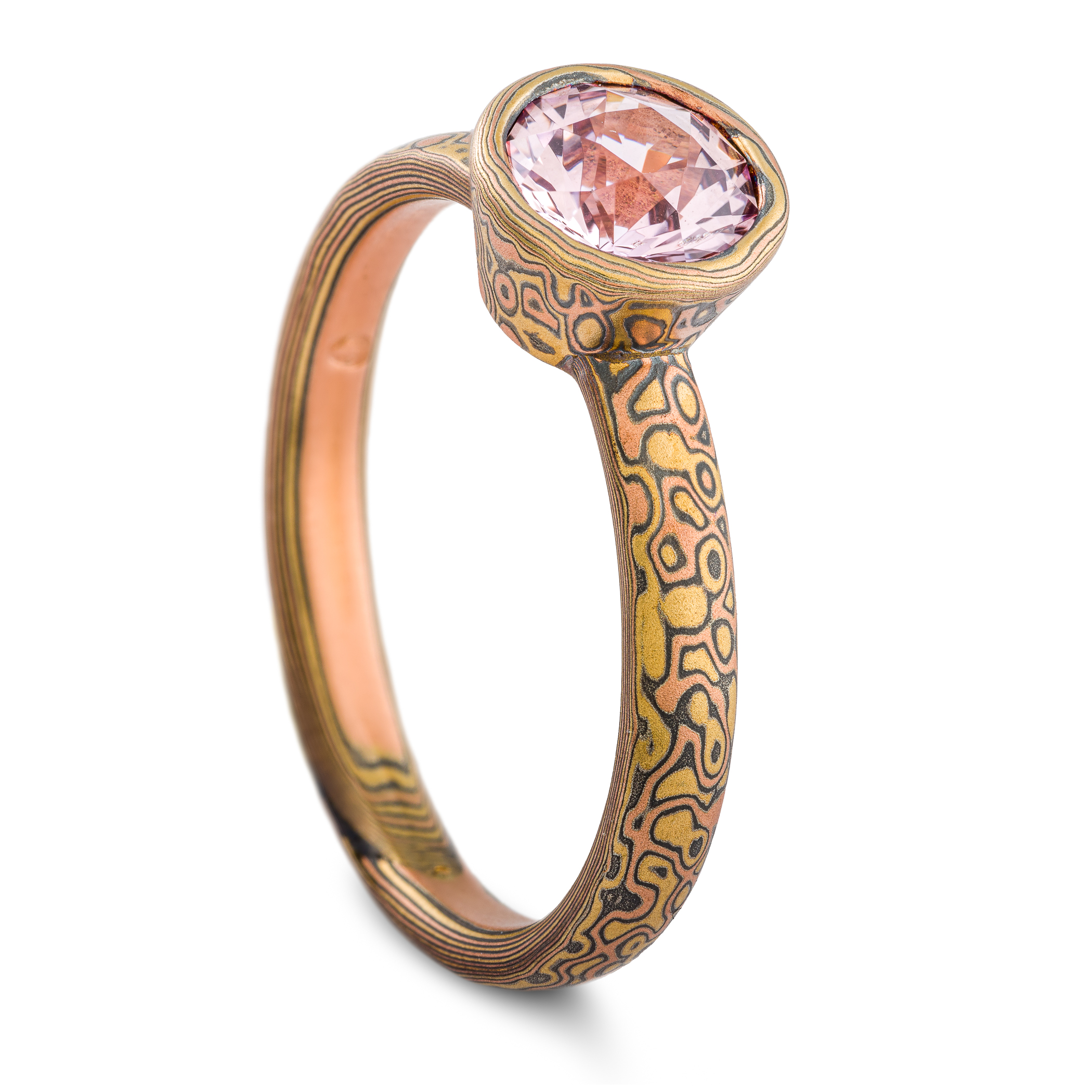 Mokume Gane ring or engagement ring arn krebs, pink sapphire in a mokume bezel, droplet pattern and fire palette, yellow gold red gold and silver