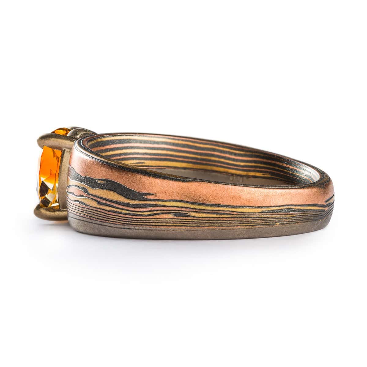 Mokume Gane ring with Fire metal combo, custom landscape design, sapphire, 14k yellow & red gold, sterling silver.