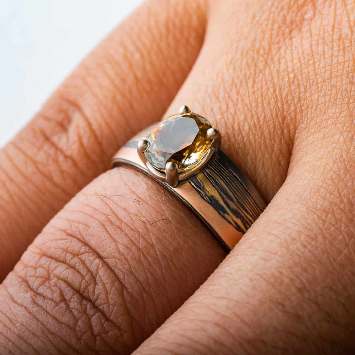Mokume Gane ring with Fire metal combo, custom landscape design, sapphire, 14k yellow & red gold, sterling silver.
