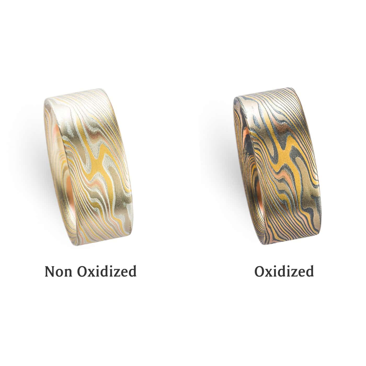 graphic of the same mokume gane ring pictured twice side by side, the ring on the right has an oxidized finish where the layers of silver in the ring have been darkened to an almost black color, giving it an overall darker look, while the ring on the left has not been oxidized, but the silver layers have been etched for added contrast. beneath the left ring is text reading "non oxidized" and beneath the right ring is text reading "oxidized"