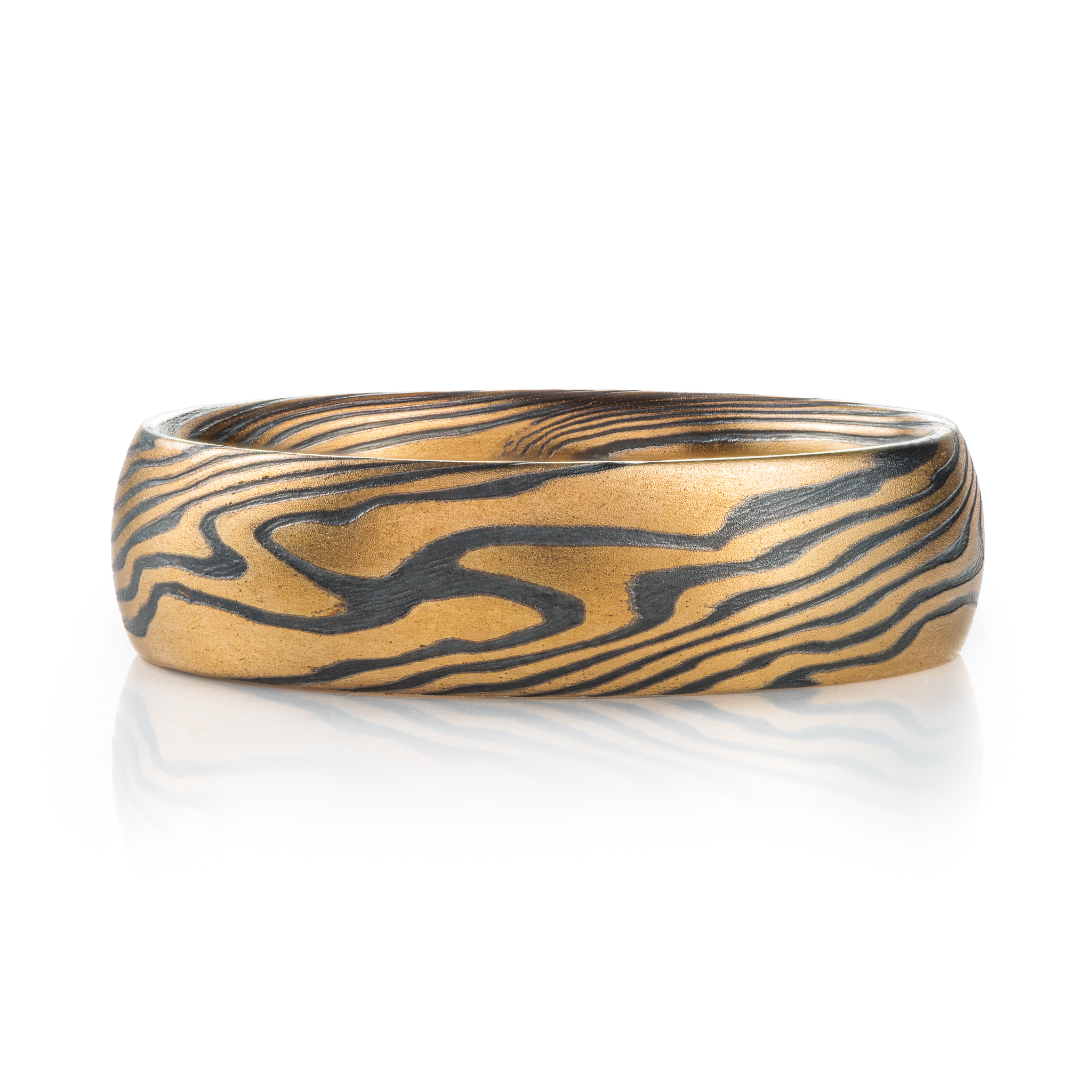 mokume gane twist pattern ring with yellow gold and oxidized silver