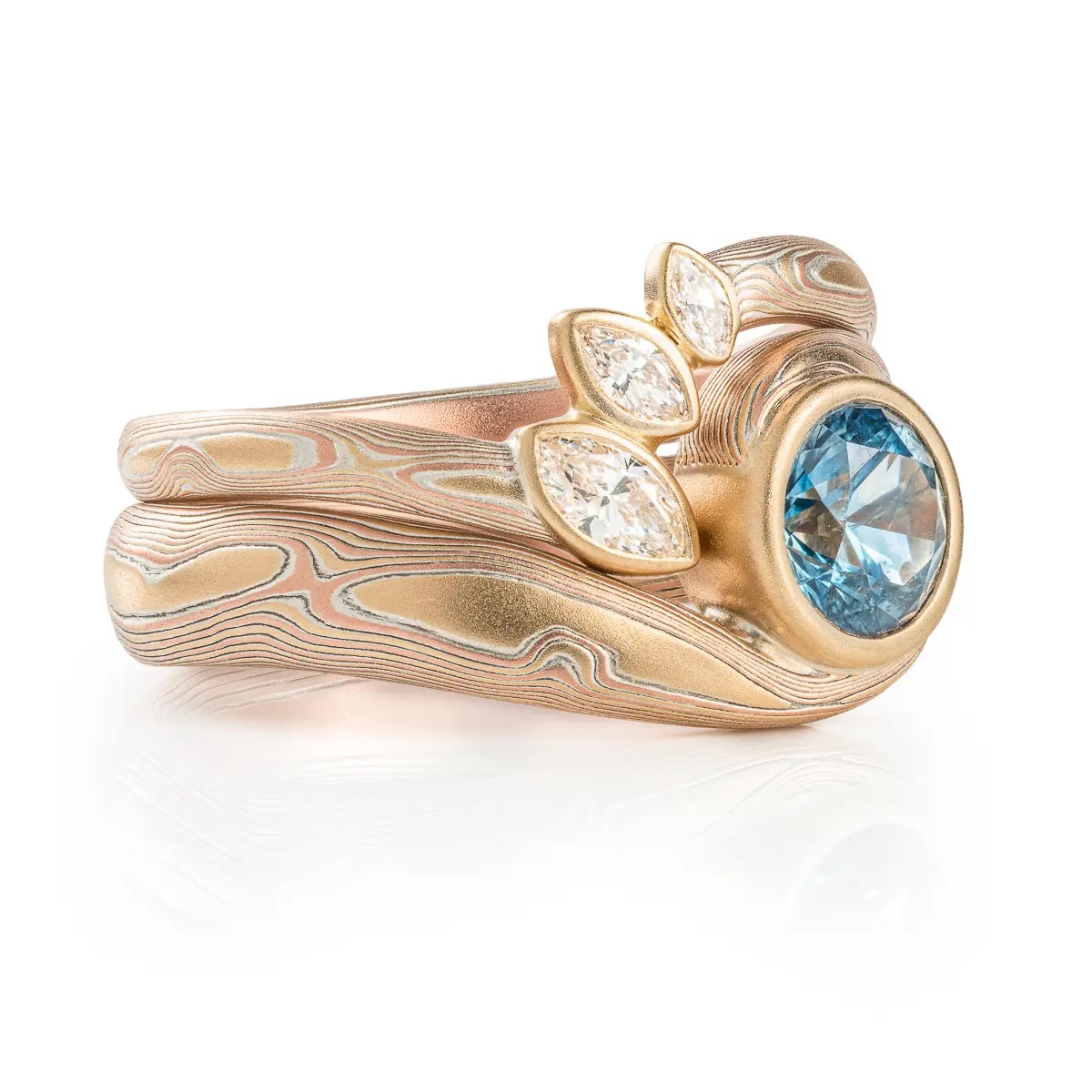 Mokume Gane ring, curved band with three delicate marquise cut diamonds, gives the feeling of leaves on a branch