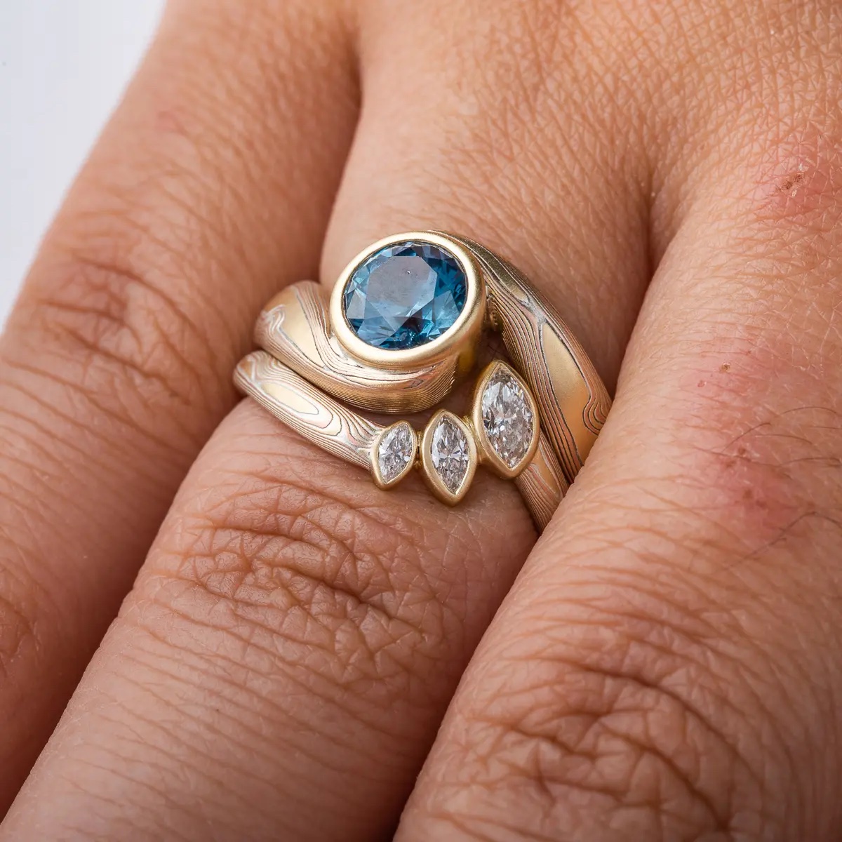 Mokume Gane ring, curved band with three delicate marquise cut diamonds, gives the feeling of leaves on a branch