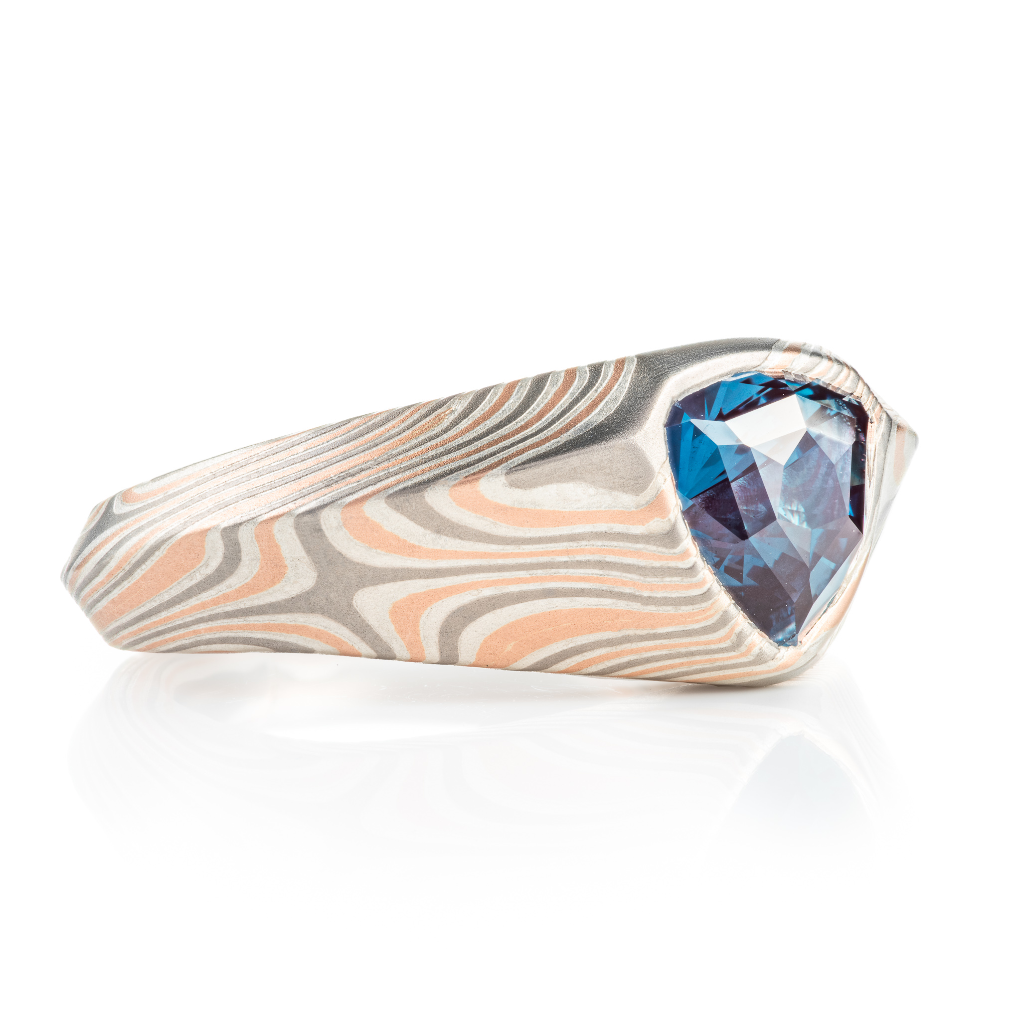 custom made mokume gane ring, wide tapered ring with a beveled edge and large triangular blue stone