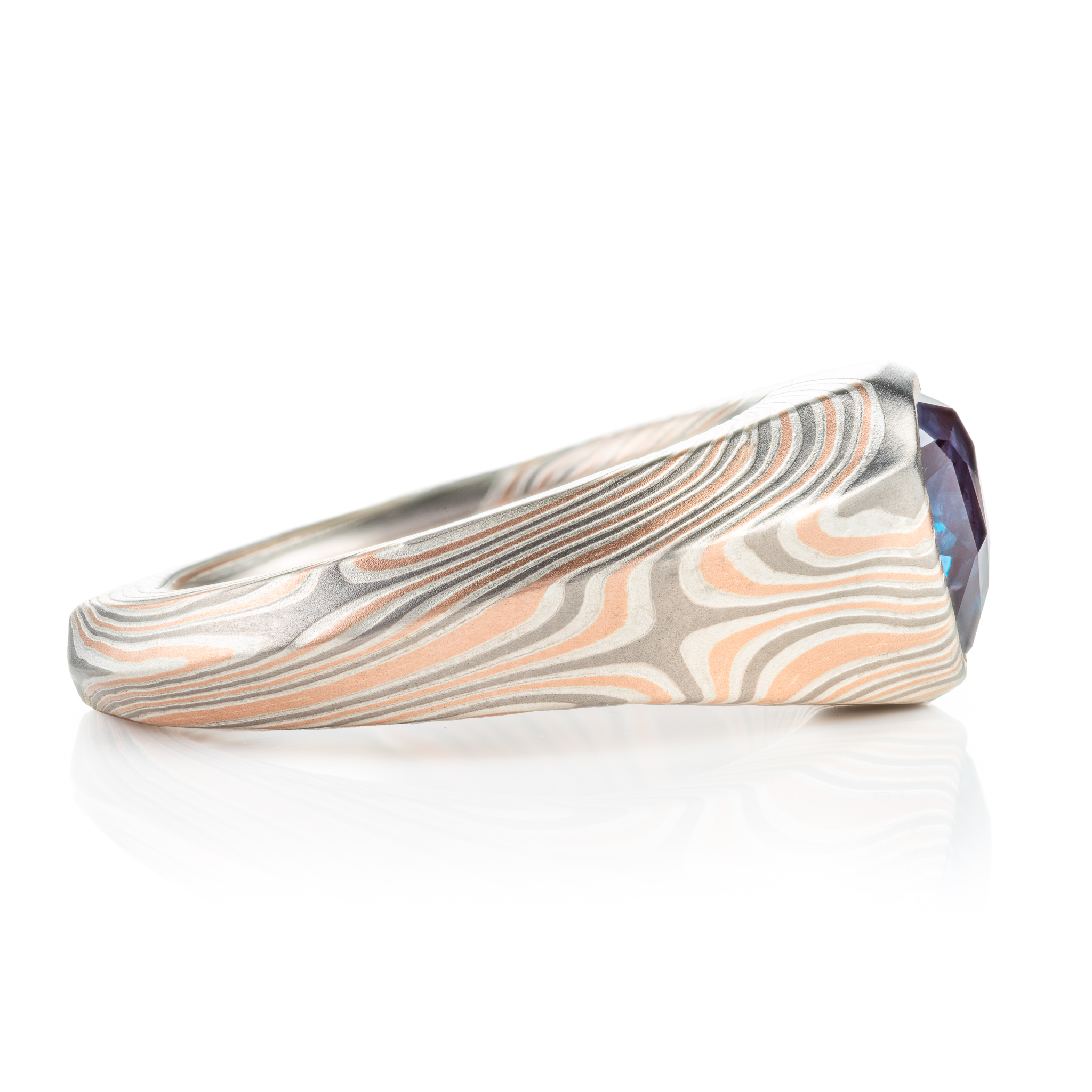 custom made mokume gane ring, wide tapered ring with a beveled edge and large triangular blue stone