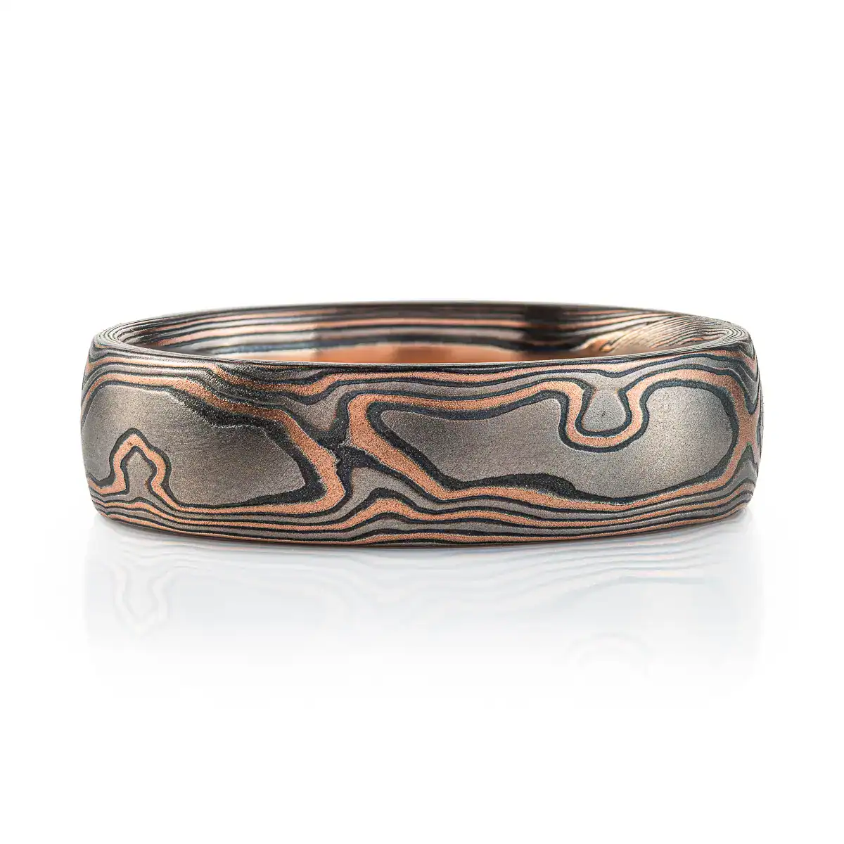 woodgrain patterned mokume gane ring with red gold, palladium and oxidized silver