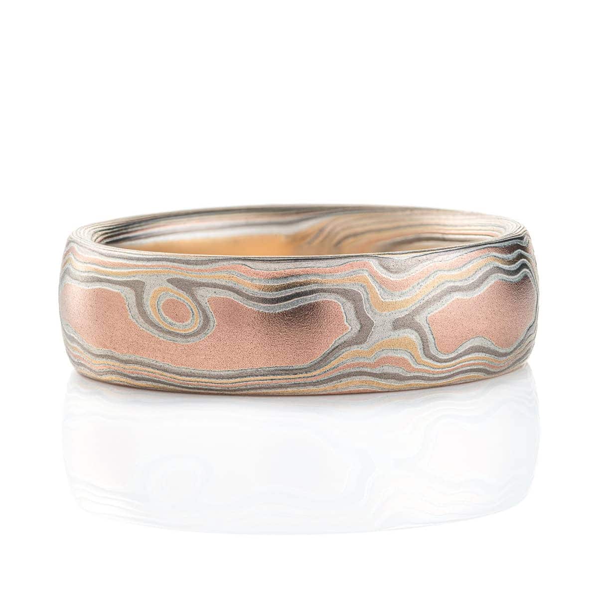 Light feeling men's mokume gane ring made to look like wood grain, made with red gold, yellow gold, palladium and etched silver.