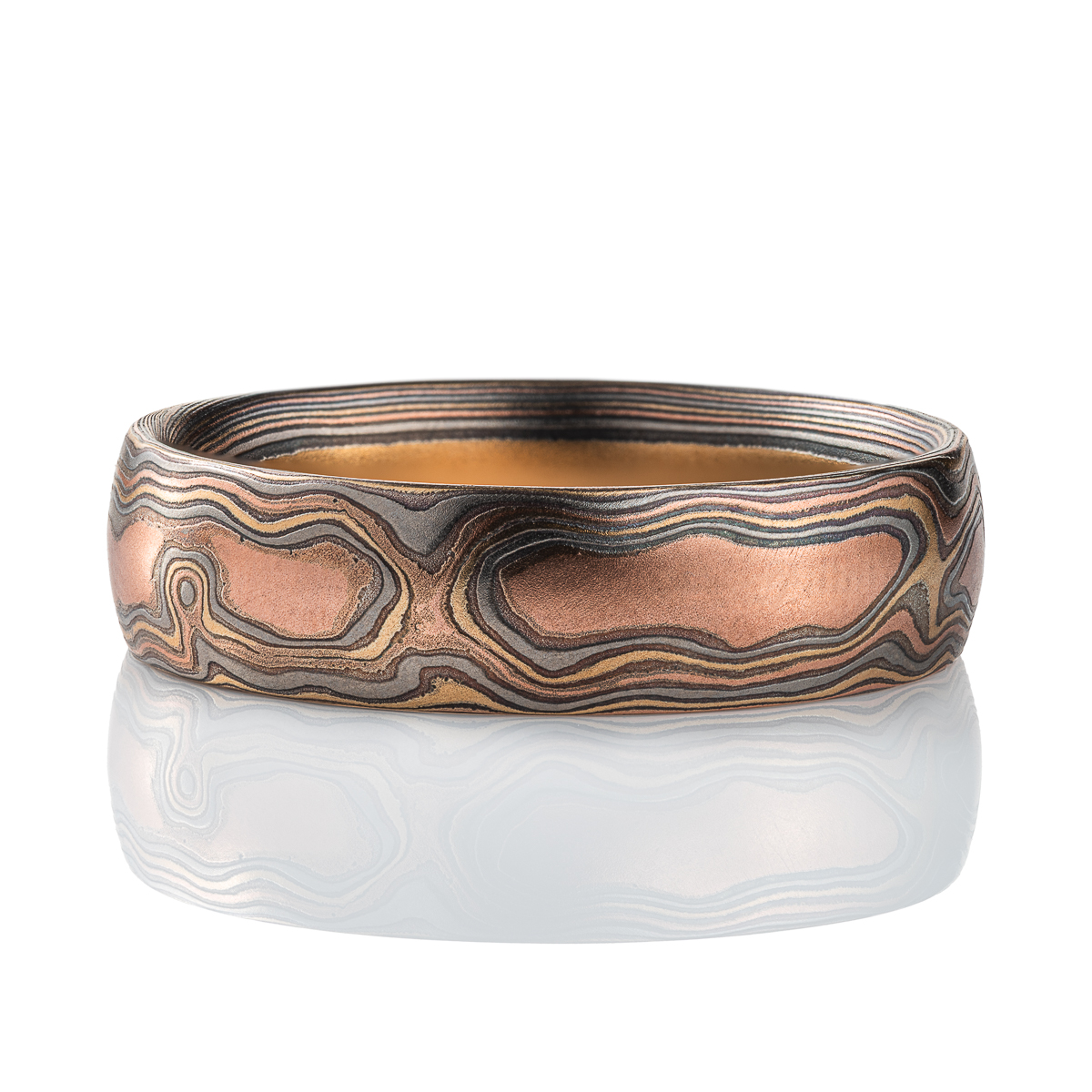 Mens mokume gane woodgrain patterned band, made with red gold, yellow gold, palladium and silver.