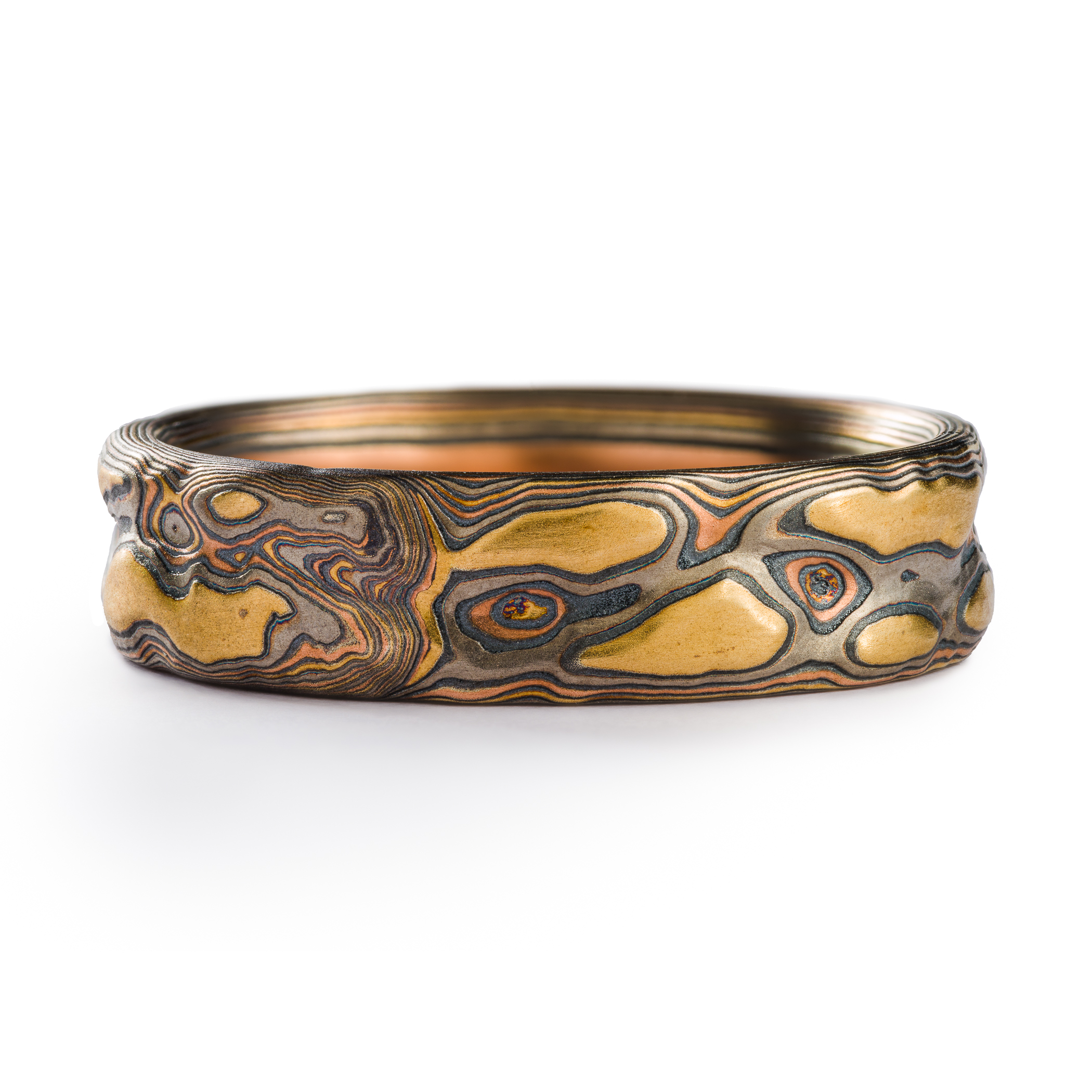 This 6mm Mokume Gane ring in Guri Bori style has a unique tactile beauty with swirling patterns in the Firestorm metal combination.