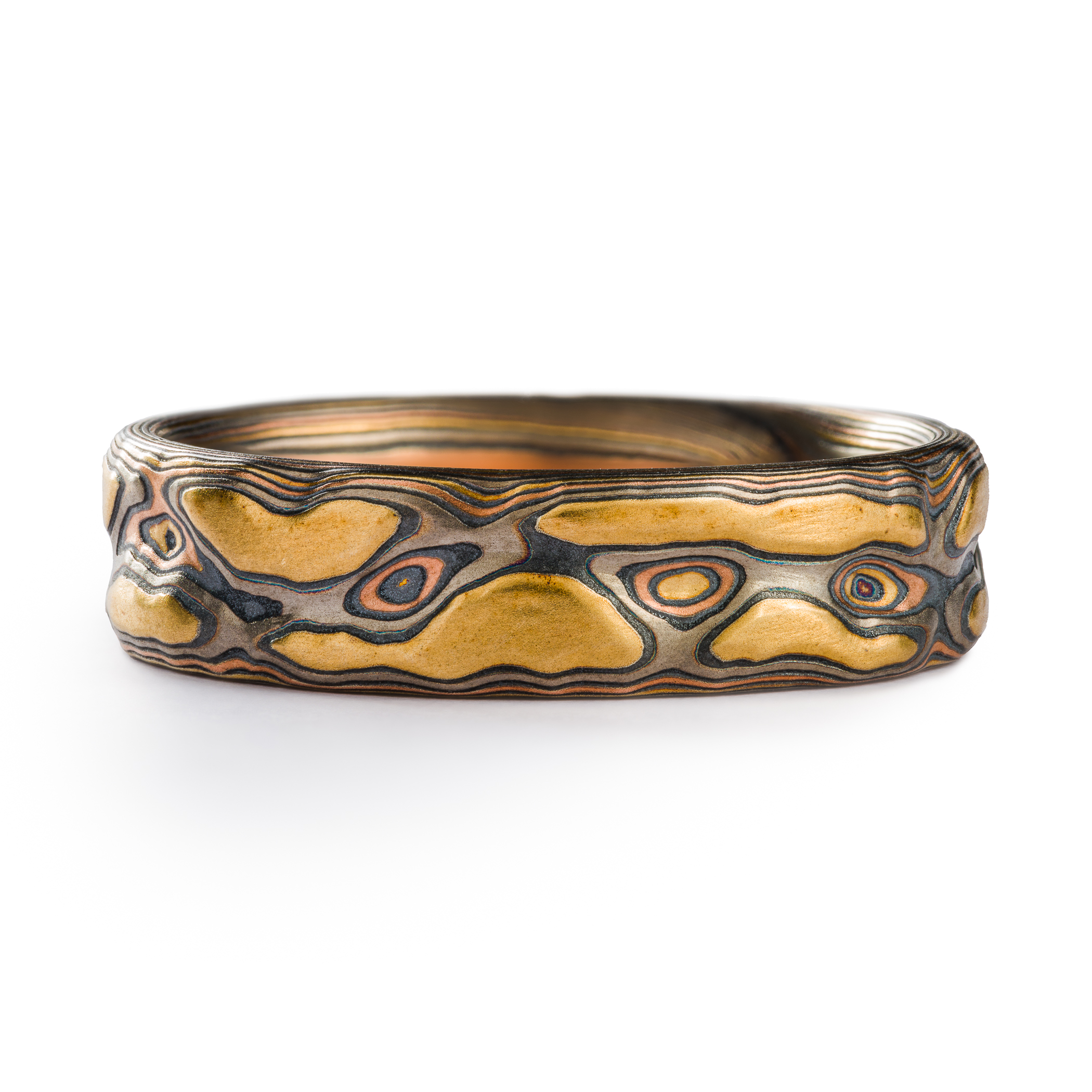 This 6mm Mokume Gane ring in Guri Bori style has a unique tactile beauty with swirling patterns in the Firestorm metal combination.